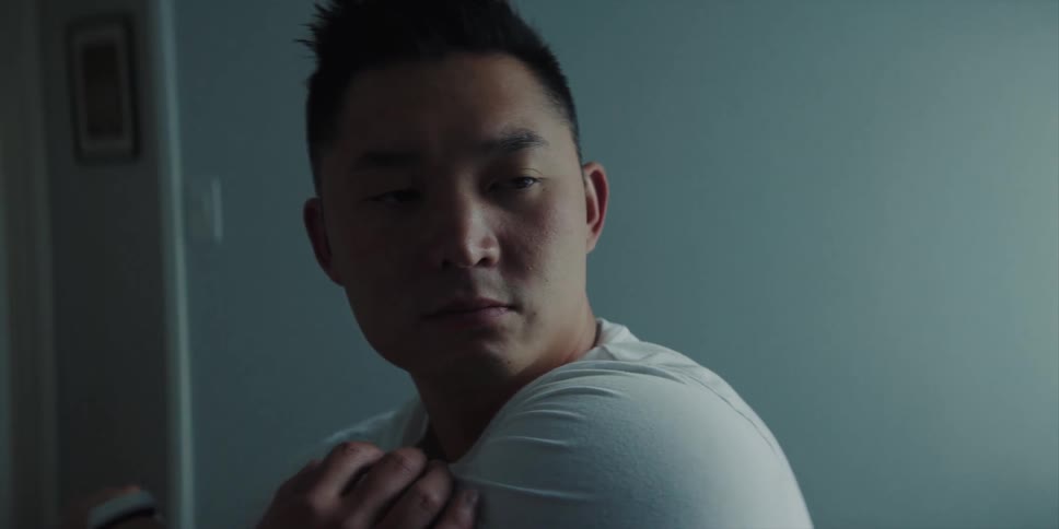 A man is stretching in the room