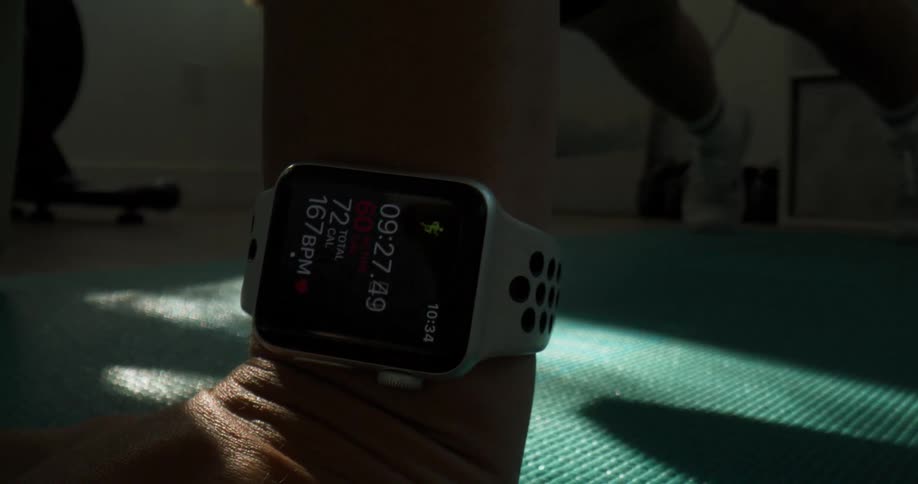 A woman is working out in an indoor room