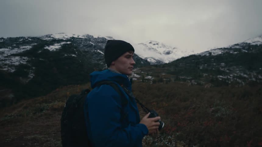 A man walking around with a camera