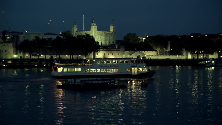 A boat on a body of water at night