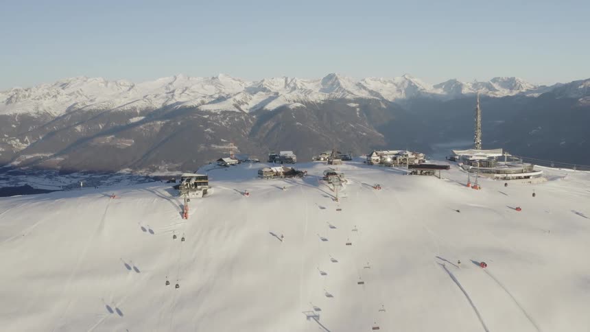 An aerial view of a mountain with snow