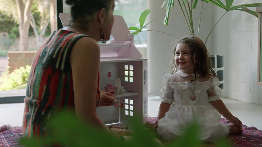 A grandmother talks to her granddaughter