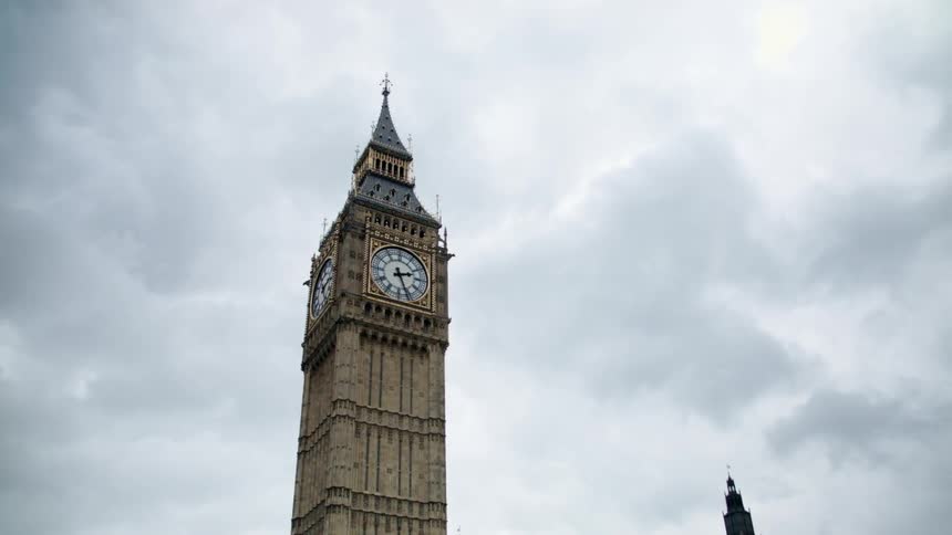 Big ben tower stands out against a grey, cloudy sky
