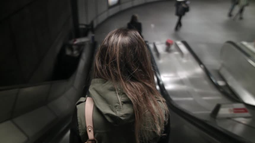 People are riding an escalator