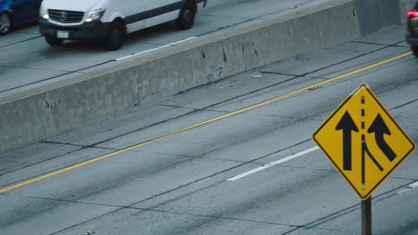 Vehicles driving down a street