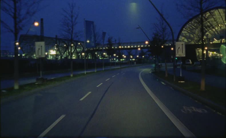 The road is empty by the building