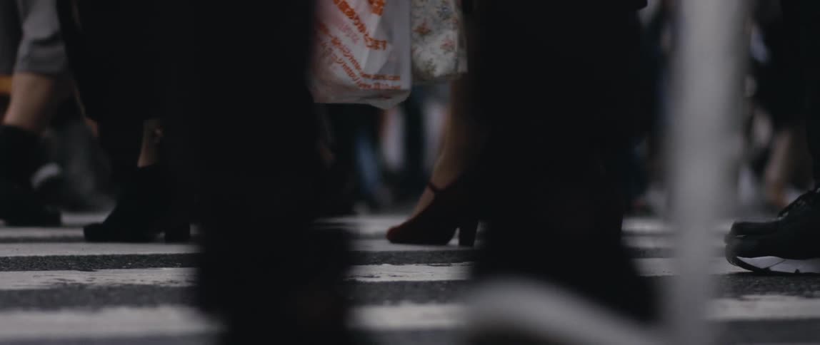 People are walking on a street in a downtown city