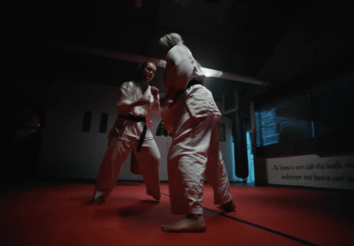 Two young female athletes are training and boxing each other