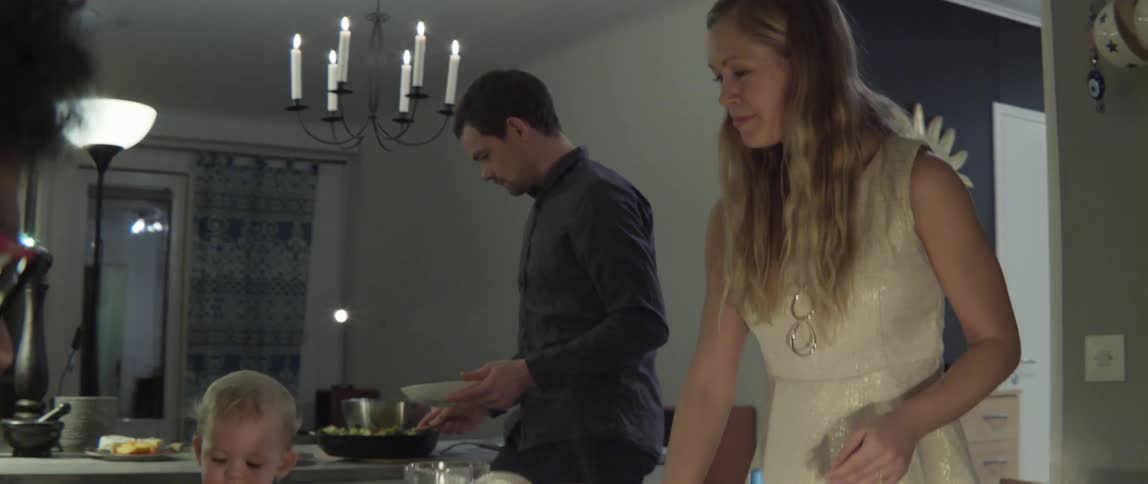 Group of people dining together at home with lively social connection