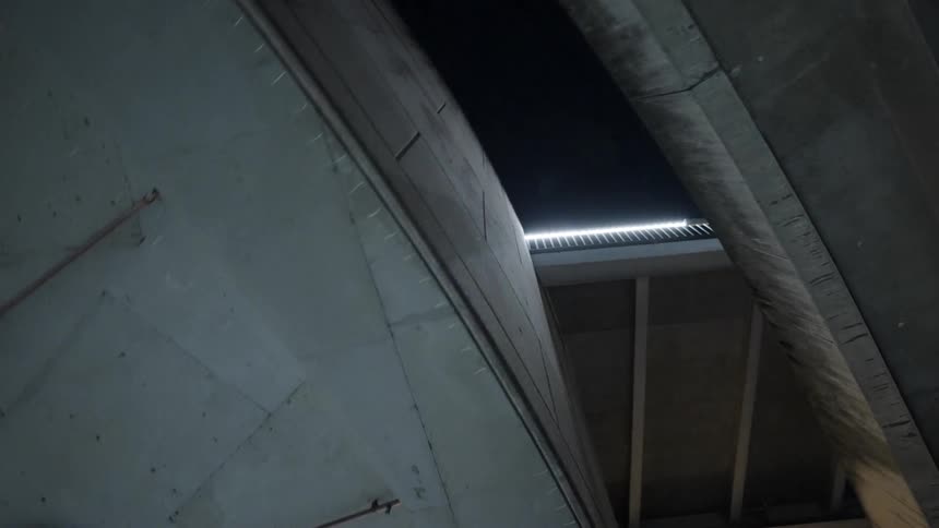 Light shines through gap between segments of structure
