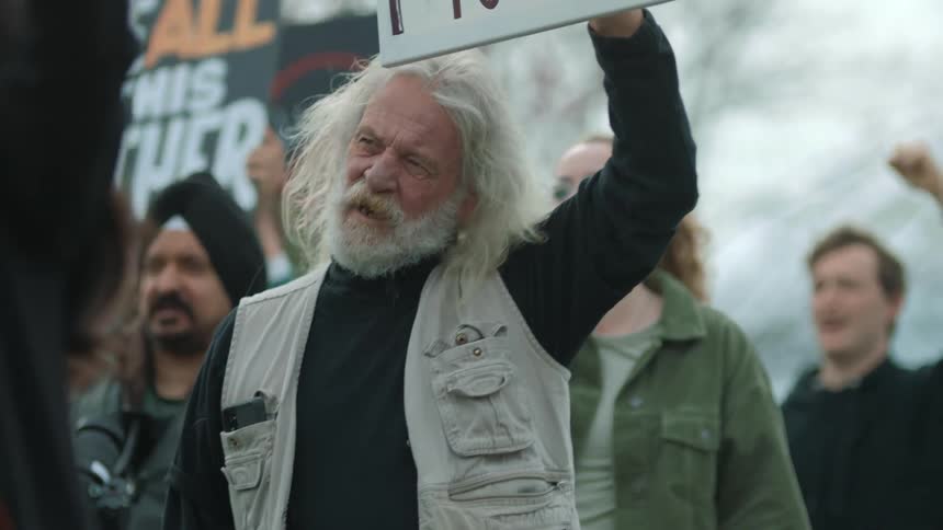 Protesters carry signs and march