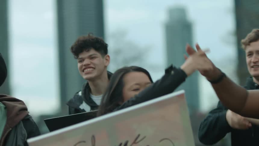 Protesters cheer and talk together