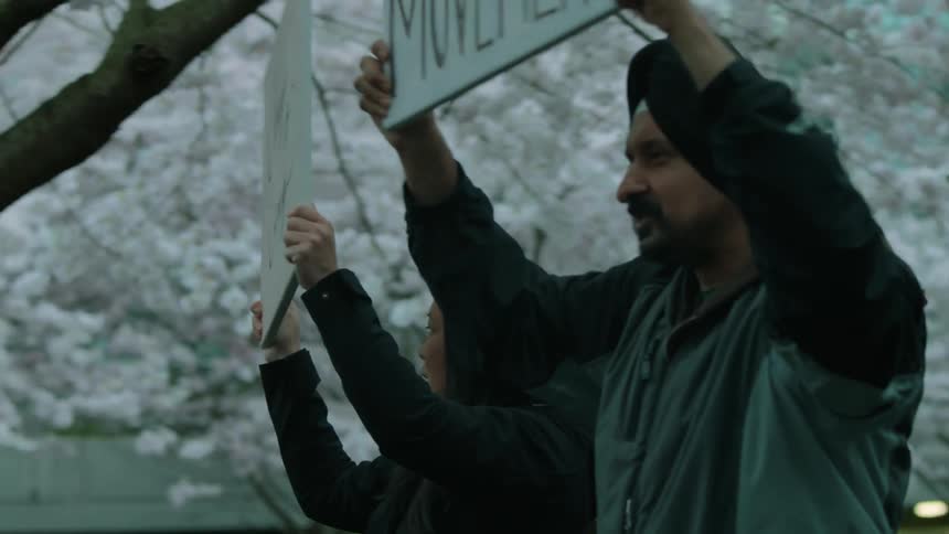 People are protesting around trees