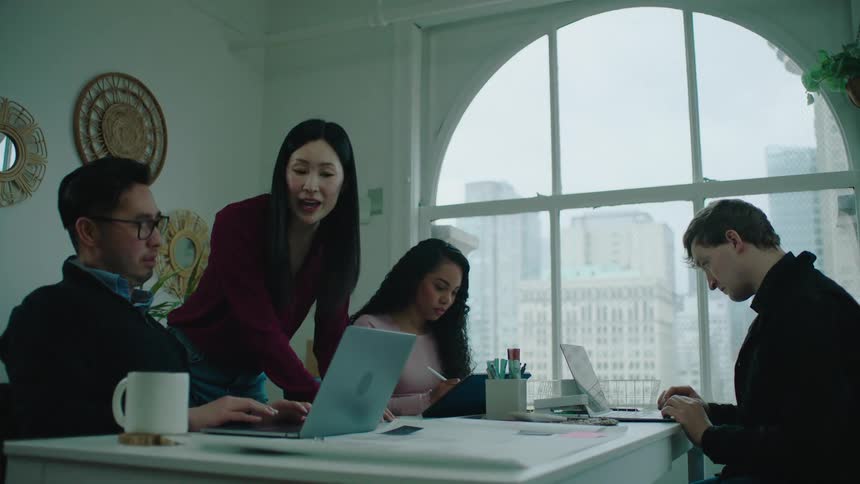 Coworkers talk in the office