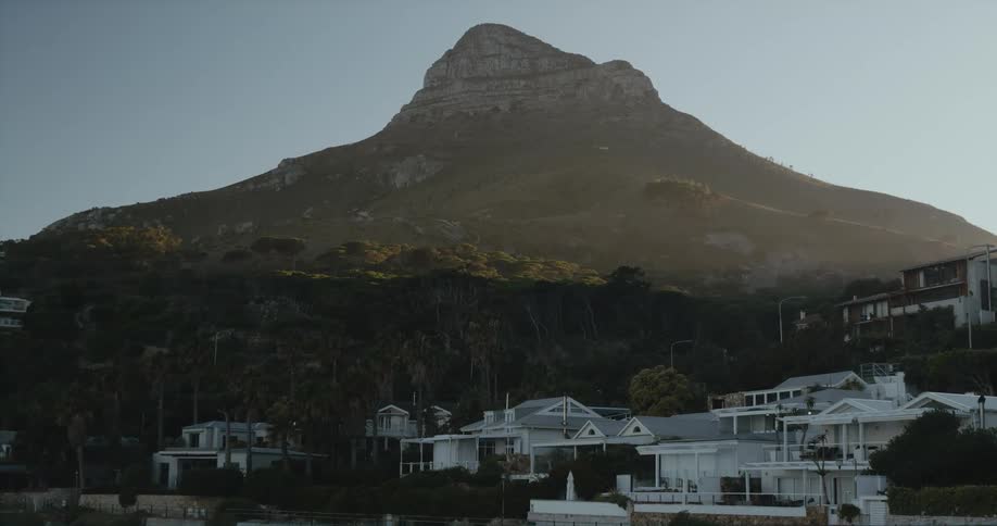 A neighborhood sits at the base of a mountain