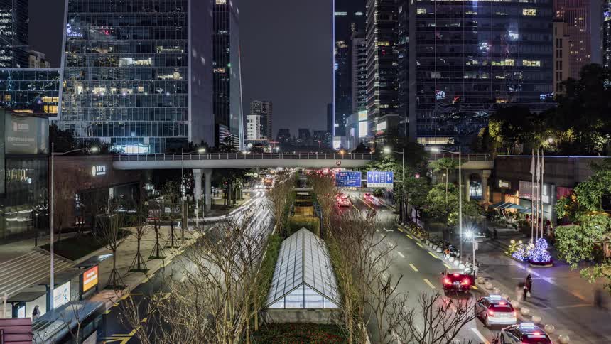 Time lapse view of people and traffic in a downtown city