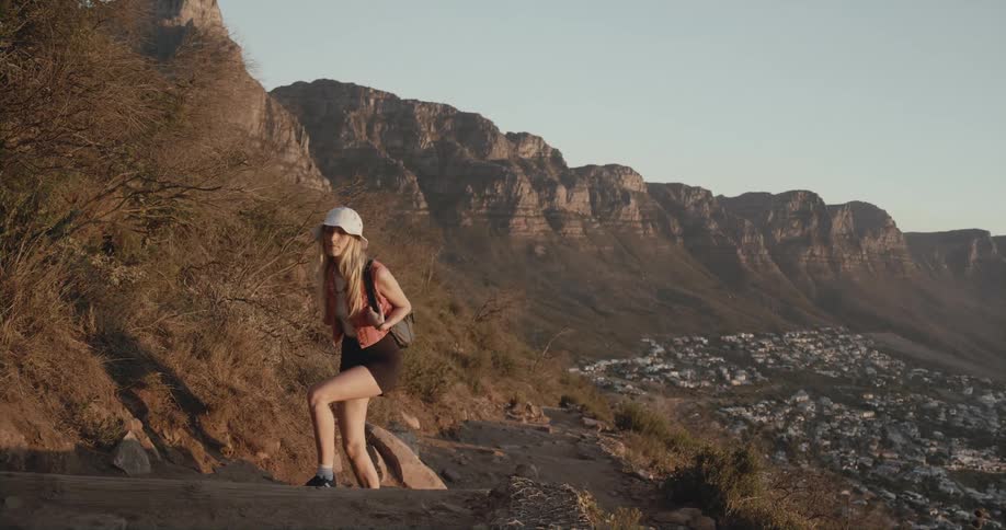 A woman hikes up the hill