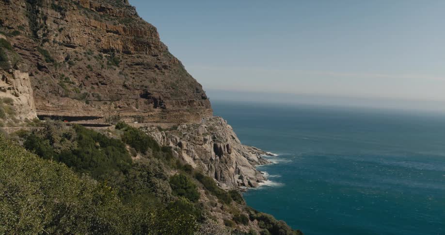 A steep ocean coastline during the day