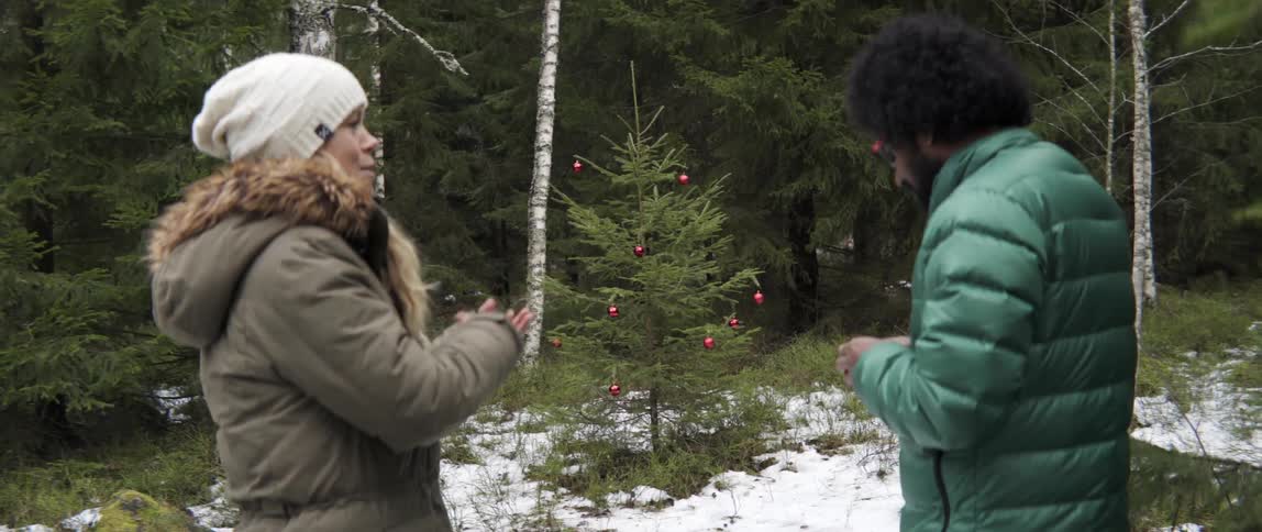 Man and woman chatting in snowy woods on a peaceful winter day