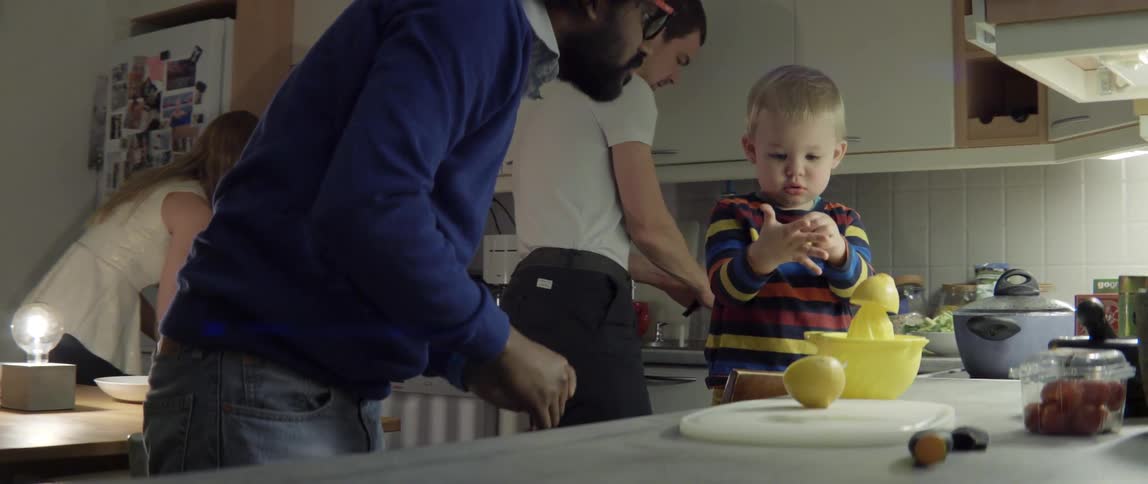 Man and Toddler Juicing Fresh Lemons Together in the Kitchen With Loving Shared Energy