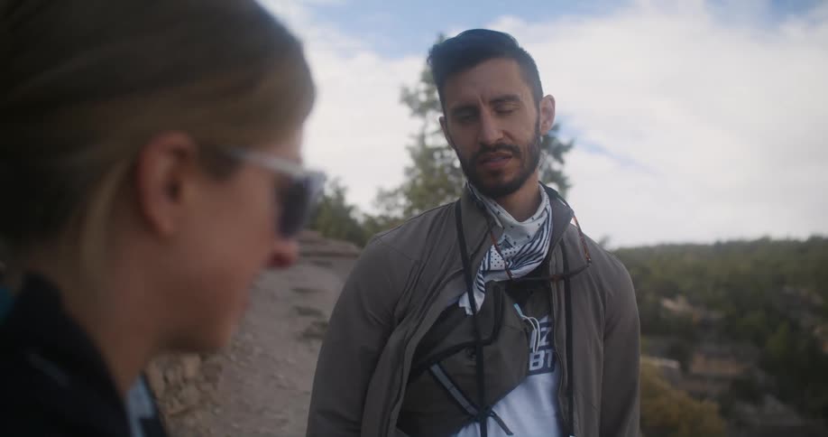 A man and woman talking outdoors