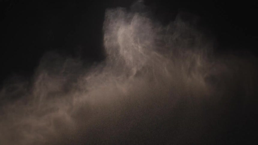 A view of sand flying through the air