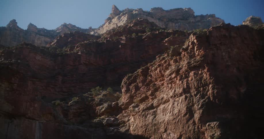 Jagged rocks on cliffs rise high in the air