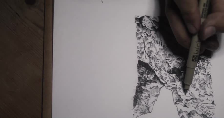 A man sketches on paper
