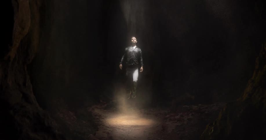 A man is floating in the cave
