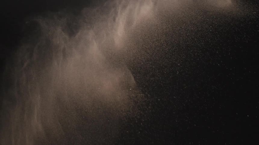 Water is tossed into the air and spreads as it falls