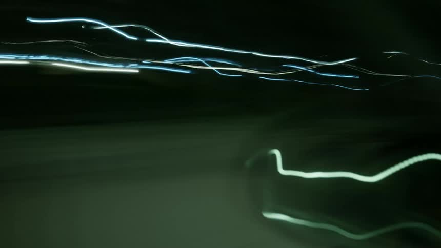 City street lights and car lights flashing and blurring at night