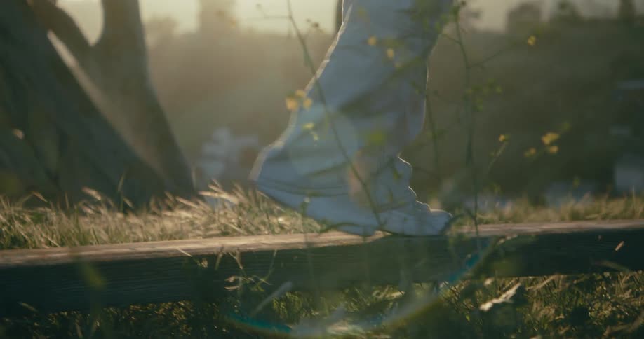 A person balances on the beam