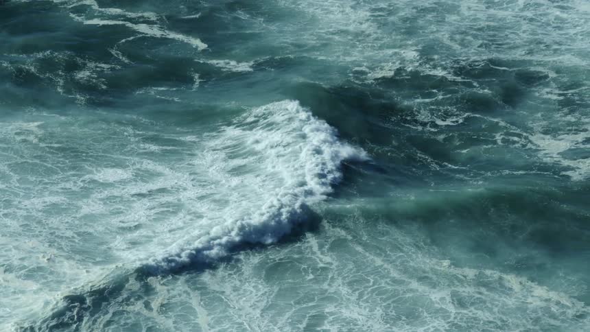 Water moves and splashes as waves roll in