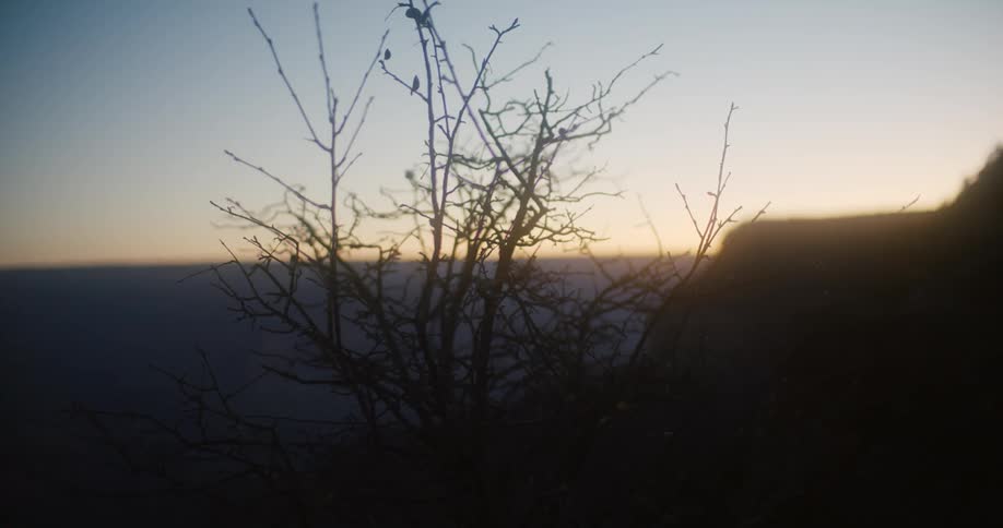 The sun is rising on the mountain range