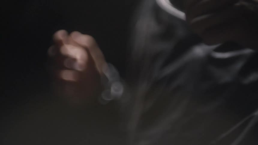 Slow motion footage of mans hands as he runs