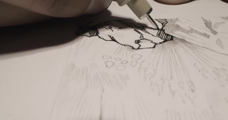 A person is drawing with a pen
