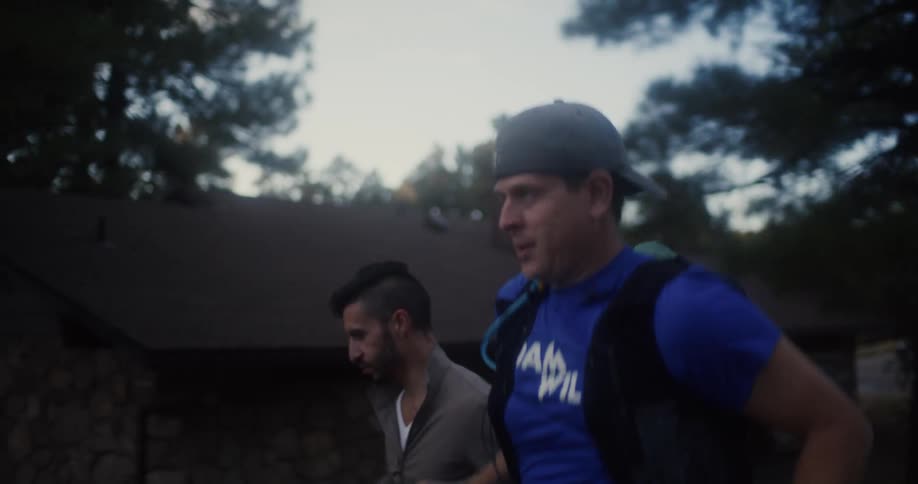 Two men jog together