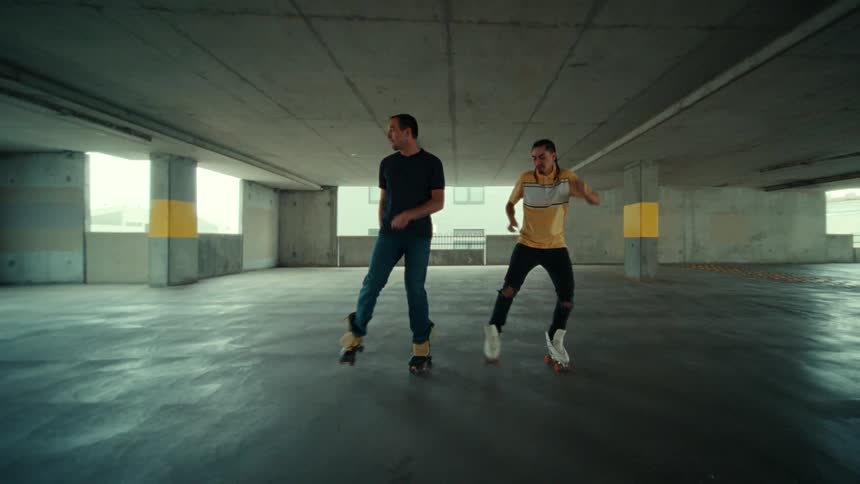 Two people dance on roller skates