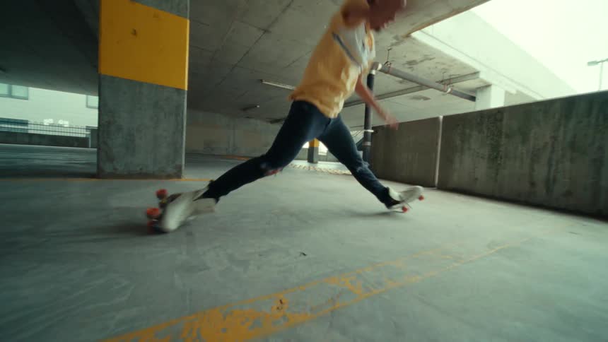 A man is dancing while wearing roller skates