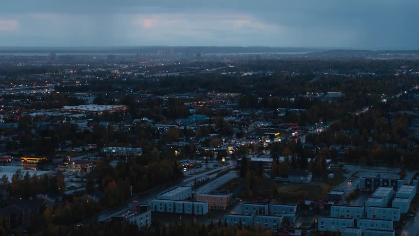 A small city under a cloudy evening sky