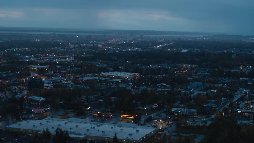 A small city under a cloudy sky in the evening