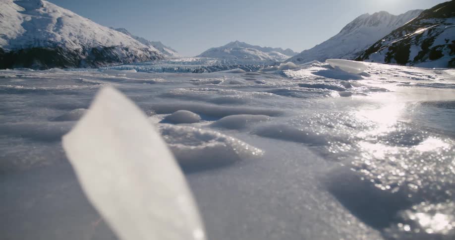 Ice glaciers near mountains are displayed