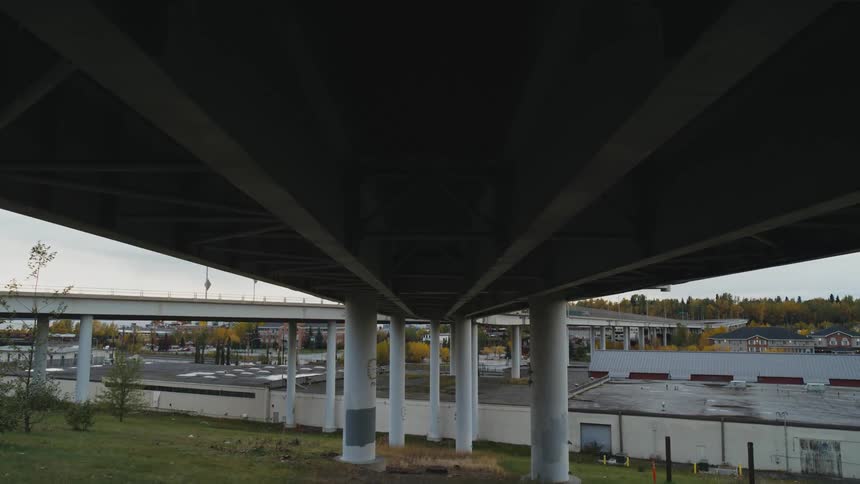 Bridges run over a river in a city