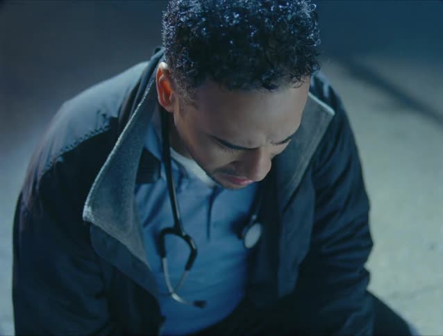 The emt is checking a person at an accident