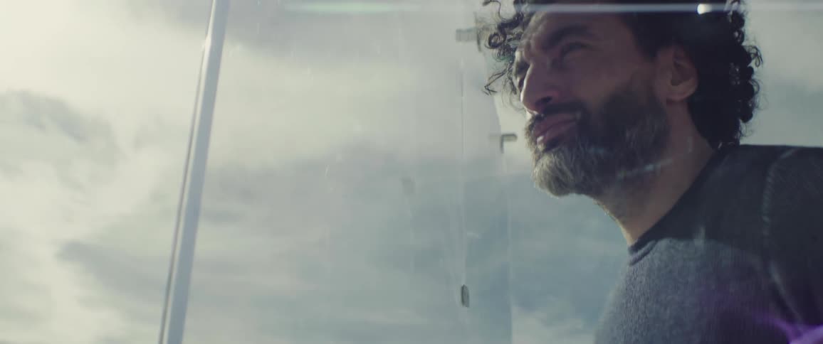A man is pacing inside a window box