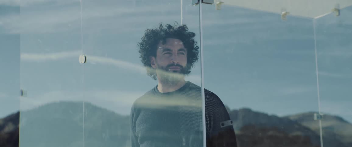 A man is in a glass prison
