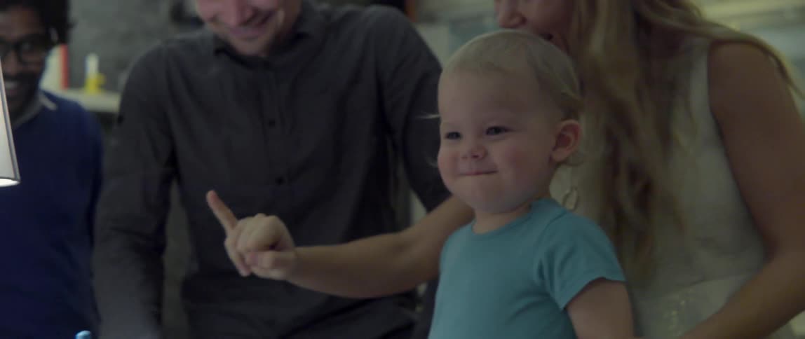 Heartwarming domestic scene of people talking and laughing together at a festive home event