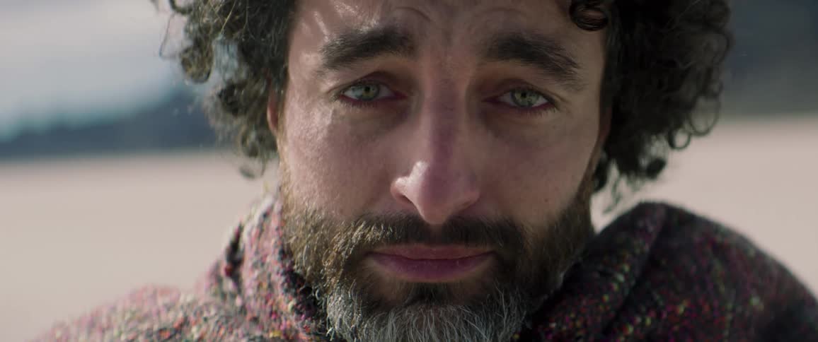 A man looks sad outside