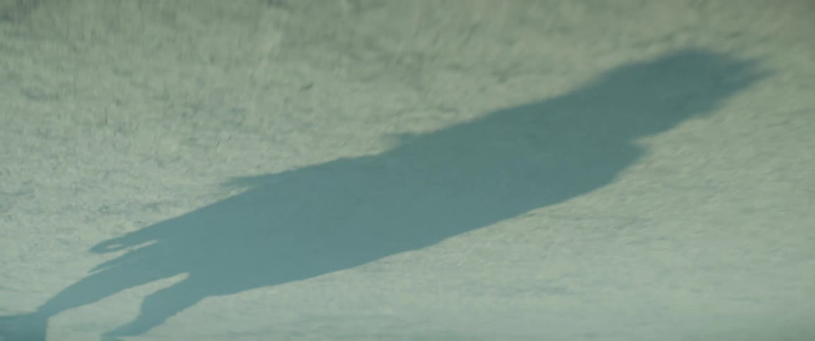 A person stumbling over desert sand