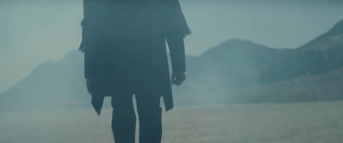 A man is walking in the desert